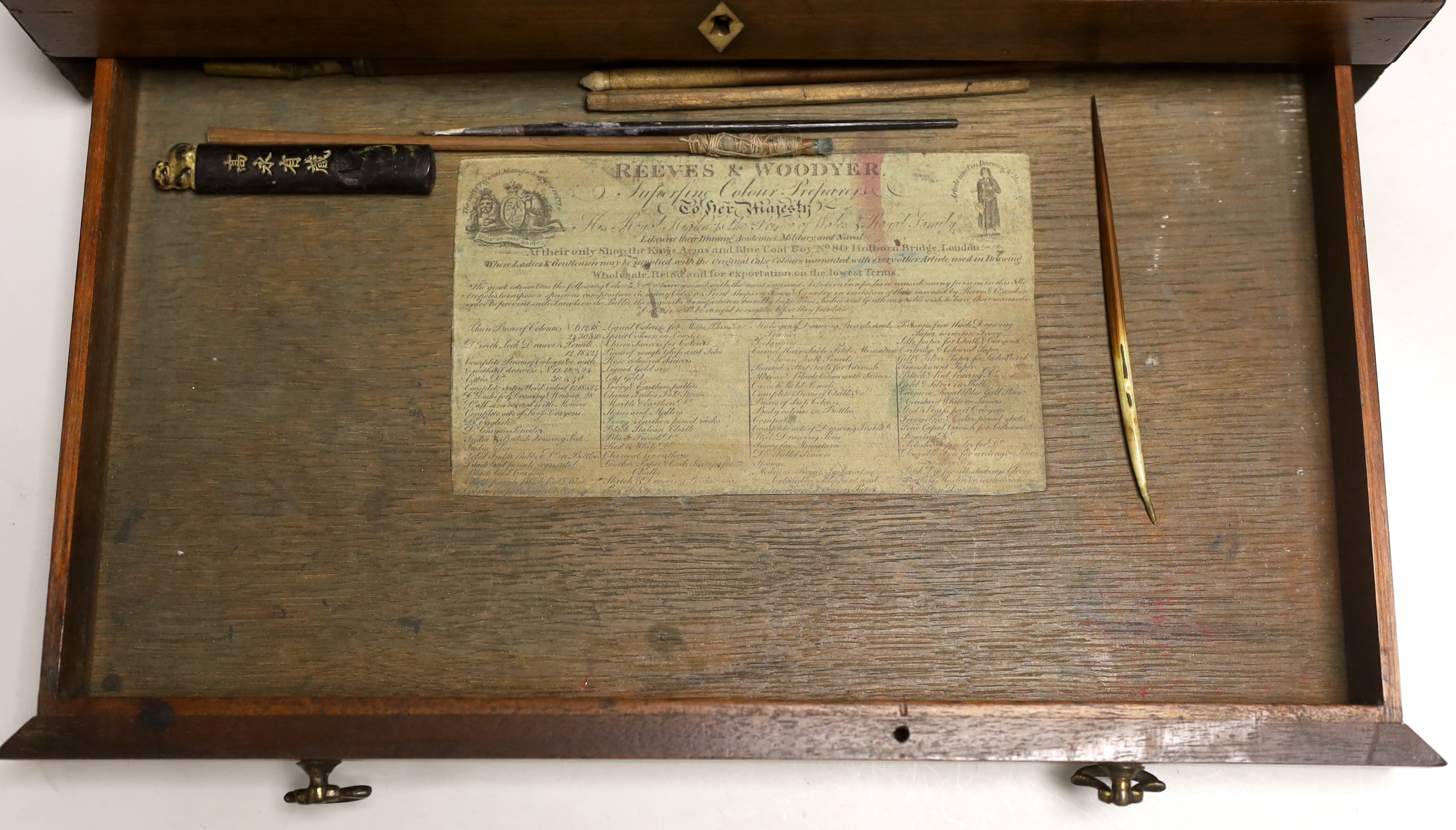 An early 19th century Reeves & Woodyer watercolourist's boxed set with fitted drawer and watercolour blocks and powder, 38cm wide